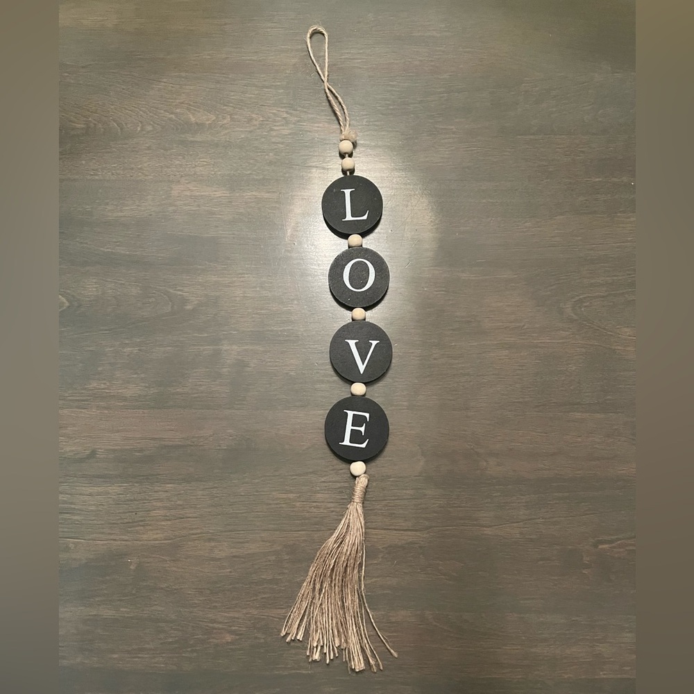 Hanging wooden Love" sign